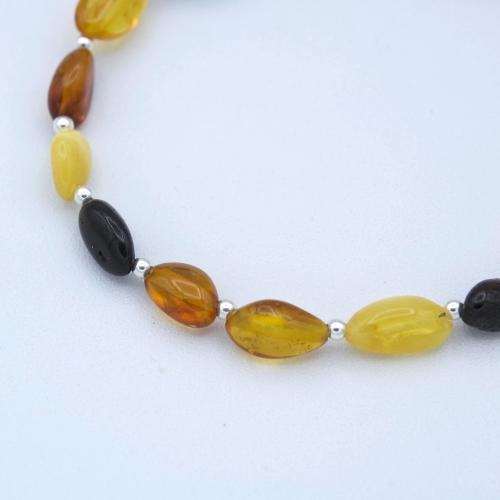 Semi-rigid amber bracelet, mixed oval beads
